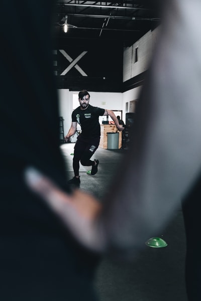 Dressed in a black T-shirt and black pants man standing next to the women who dress in black long sleeve shirt
